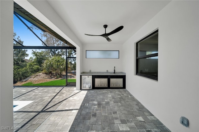 419 NW 7th Ave, Cape Coral, FL 33993 - unfurnished sunroom with a sink and wine cooler