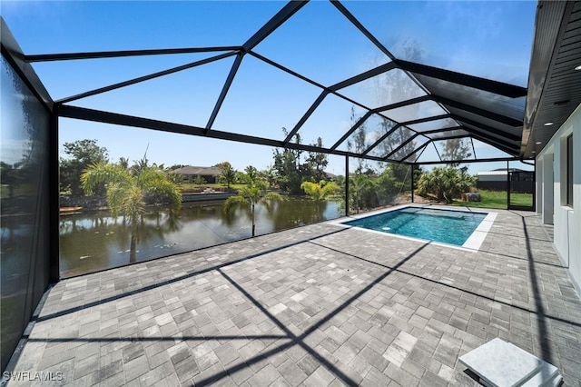419 NW 7th Ave, Cape Coral, FL 33993 - outdoor pool with a patio, a water view, and glass enclosure