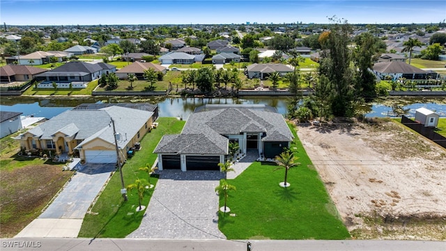 419 NW 7th Ave, Cape Coral, FL 33993 - aerial perspective of suburban area with a nearby body of water