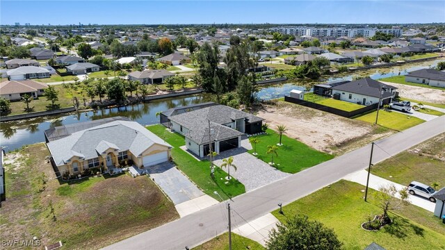 419 NW 7th Ave, Cape Coral, FL 33993 - aerial perspective of suburban area with a large body of water