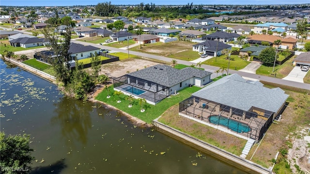 419 NW 7th Ave, Cape Coral, FL 33993 - aerial perspective of suburban area with a pool and a nearby body of water