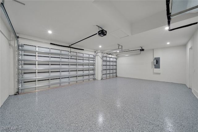 419 NW 7th Ave, Cape Coral, FL 33993 - garage with a garage door opener, electric panel, and recessed lighting
