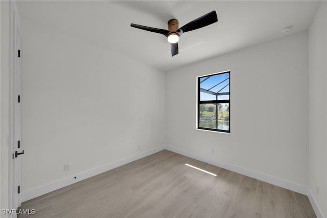 419 NW 7th Ave, Cape Coral, FL 33993 - spare room with light wood finished floors, ceiling fan, baseboards, and a smoke detector