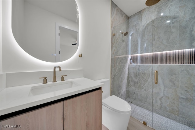 419 NW 7th Ave, Cape Coral, FL 33993 - bathroom featuring a shower stall, toilet, and vanity
