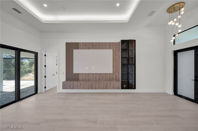 419 NW 7th Ave, Cape Coral, FL 33993 - foyer entrance with light wood-style flooring, a tray ceiling, baseboards, and recessed lighting