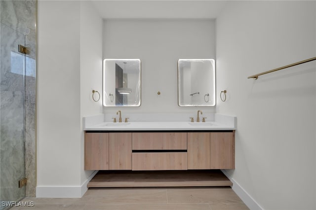 419 NW 7th Ave, Cape Coral, FL 33993 - bathroom featuring baseboards, double vanity, and a shower stall