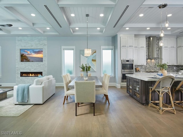 242 2nd Ave S, Naples, FL 34102 - dining area featuring light wood finished floors, baseboards, coffered ceiling, recessed lighting, and beam ceiling