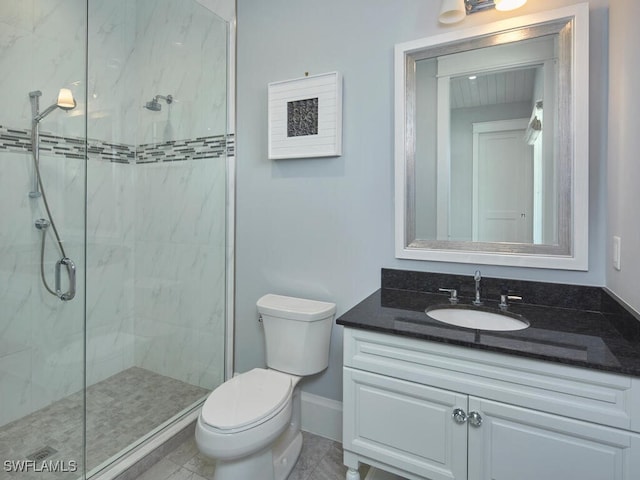242 2nd Ave S, Naples, FL 34102 - bathroom with toilet, a marble finish shower, vanity, and baseboards
