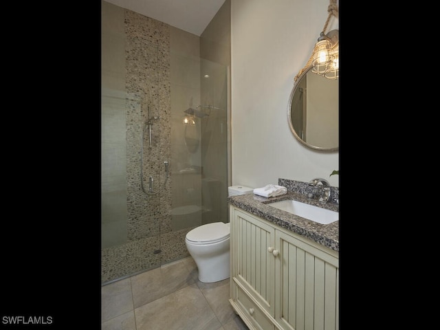242 2nd Ave S, Naples, FL 34102 - full bathroom with a shower stall, vanity, toilet, and tile patterned floors