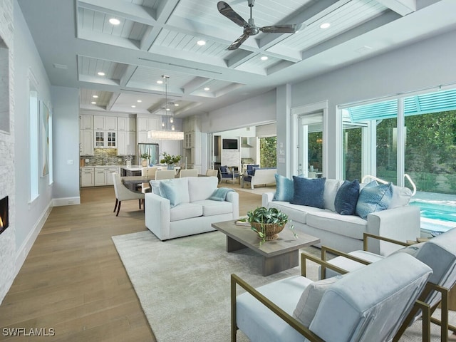 242 2nd Ave S, Naples, FL 34102 - living room with coffered ceiling, recessed lighting, light wood-style floors, beam ceiling, and a ceiling fan