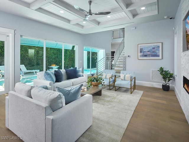 242 2nd Ave S, Naples, FL 34102 - living room with ceiling fan, coffered ceiling, beam ceiling, wood finished floors, and baseboards