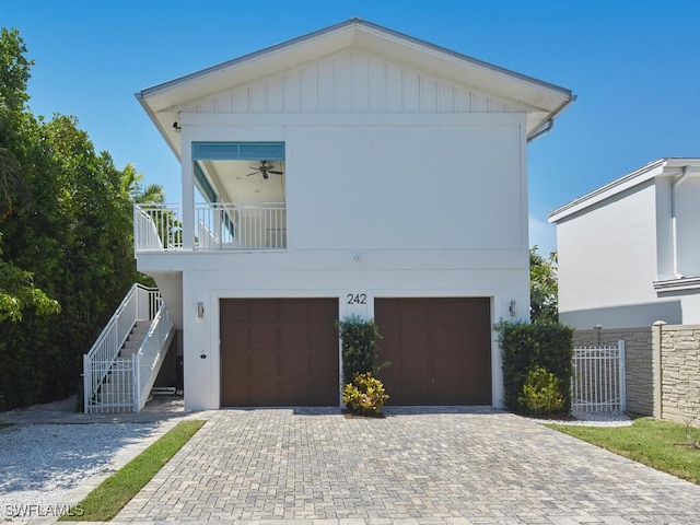 242 2nd Ave S, Naples, FL 34102 - view of front of home featuring an attached garage, stairs, and decorative driveway