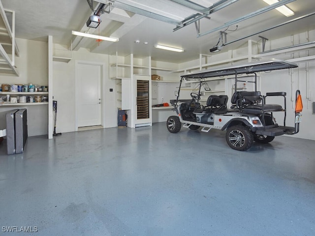 242 2nd Ave S, Naples, FL 34102 - garage featuring a garage door opener