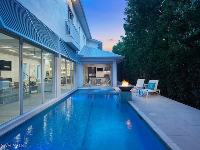 242 2nd Ave S, Naples, FL 34102 - swimming pool with a patio area and a fire pit