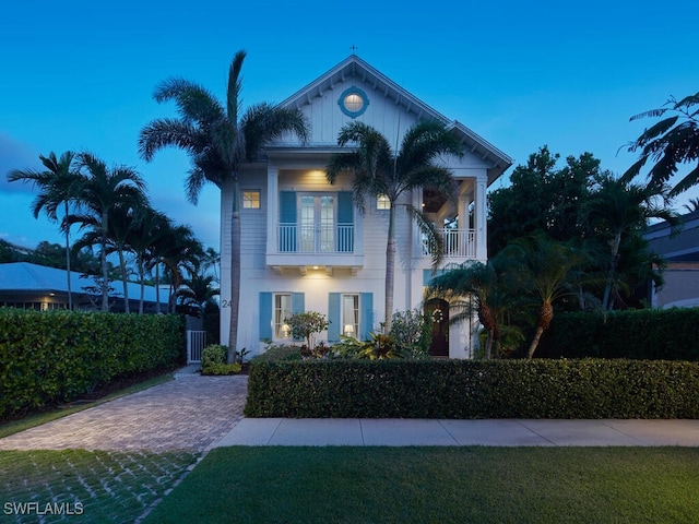 242 2nd Ave S, Naples, FL 34102 - view of front of house featuring a balcony and french doors