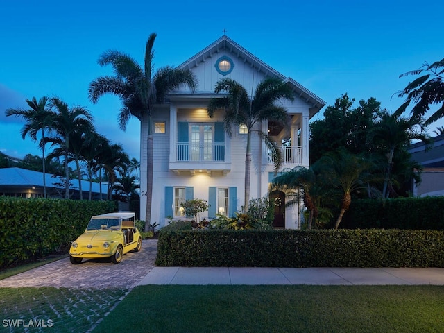 242 2nd Ave S, Naples, FL 34102 - view of front of home with a balcony and driveway