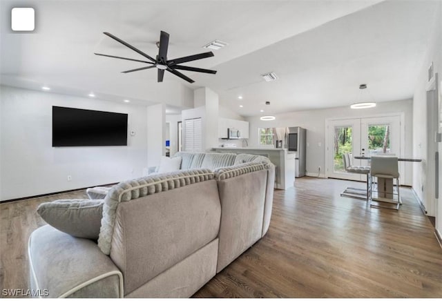 5005 Squaw Ln, Labelle, FL 33935 - living room with french doors, lofted ceiling, light wood-style flooring, baseboards, and a ceiling fan