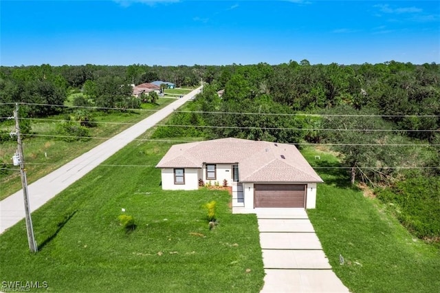 3601 E 18th St, Lehigh Acres, FL 33972 - view from above of property with a forest