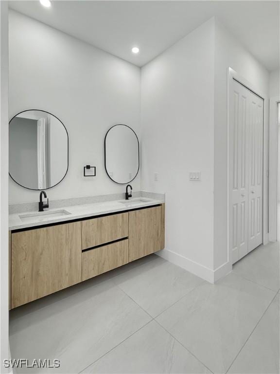3247 72nd Ave NE, Naples, FL 34120 - full bath with double vanity, tile patterned flooring, baseboards, and recessed lighting