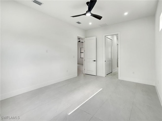 3247 72nd Ave NE, Naples, FL 34120 - unfurnished bedroom with baseboards, recessed lighting, ceiling fan, and light tile patterned flooring