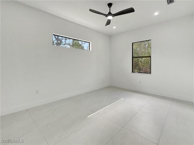 3247 72nd Ave NE, Naples, FL 34120 - empty room featuring plenty of natural light, recessed lighting, baseboards, light tile patterned flooring, and a ceiling fan