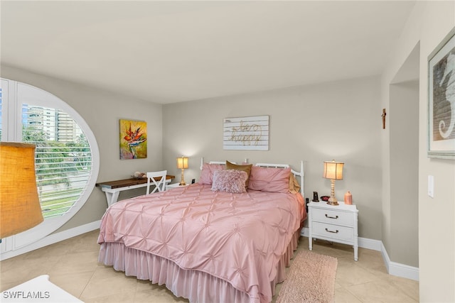 741 S Collier Blvd Unit 302, Marco Island, FL 34145 - bedroom featuring light tile patterned floors and baseboards