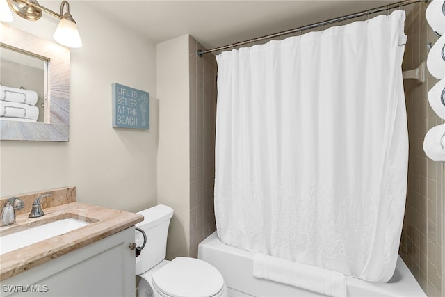 741 S Collier Blvd Unit 302, Marco Island, FL 34145 - bathroom featuring shower / bath combination with curtain, vanity, and toilet