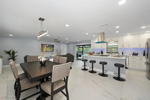 52 Fairview Blvd, Fort Myers Beach, FL 33931 - dining space featuring recessed lighting, light marble finish floors, ceiling fan, and baseboards