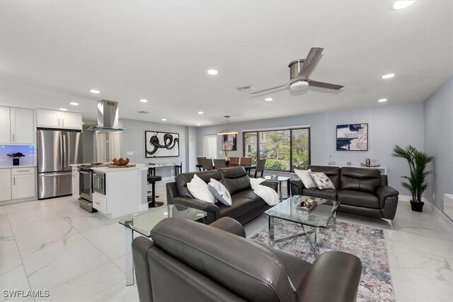 52 Fairview Blvd, Fort Myers Beach, FL 33931 - living area with recessed lighting, light marble finish flooring, and a ceiling fan