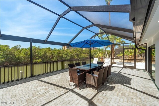 52 Fairview Blvd, Fort Myers Beach, FL 33931 - view of patio / terrace with a lanai and outdoor dining space
