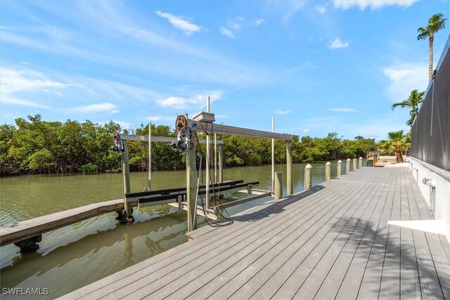 52 Fairview Blvd, Fort Myers Beach, FL 33931 - dock area featuring boat lift and a water view