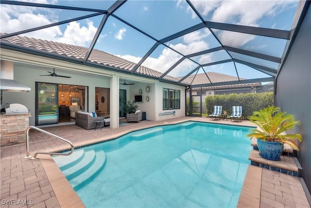 23778 Pebble Pointe Ln, Estero, FL 34135 - outdoor pool with ceiling fan, exterior kitchen, a patio area, and an outdoor hangout area