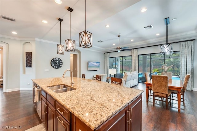 23778 Pebble Pointe Ln, Estero, FL 34135 - kitchen featuring a sink, dark wood-style flooring, baseboards, recessed lighting, and ornamental molding