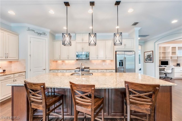 23778 Pebble Pointe Ln, Estero, FL 34135 - kitchen with stainless steel appliances, a large island, tasteful backsplash, decorative light fixtures, and recessed lighting