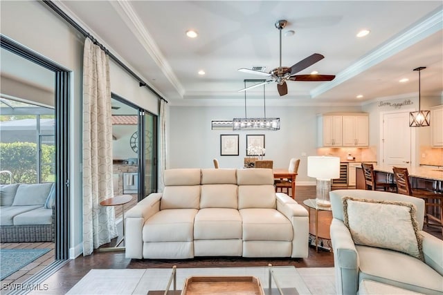 23778 Pebble Pointe Ln, Estero, FL 34135 - living area featuring ceiling fan, recessed lighting, a tray ceiling, crown molding, and dark wood finished floors