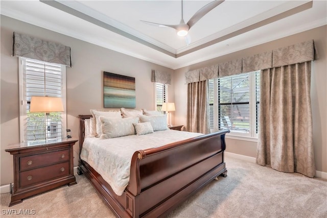 23778 Pebble Pointe Ln, Estero, FL 34135 - bedroom with ornamental molding, light colored carpet, baseboards, a raised ceiling, and ceiling fan