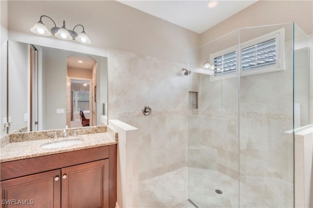 23778 Pebble Pointe Ln, Estero, FL 34135 - ensuite bathroom with a tile shower, vanity, and recessed lighting