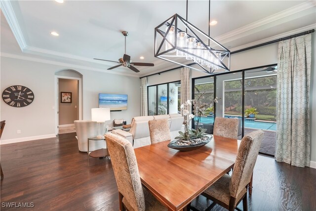 23778 Pebble Pointe Ln, Estero, FL 34135 - dining room with a ceiling fan, wood finished floors, baseboards, recessed lighting, and arched walkways