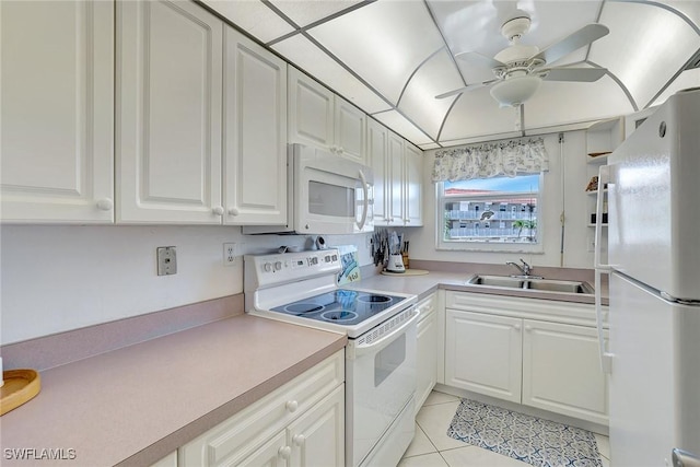 1206 Edington Pl Unit D304, Marco Island, FL 34145 - kitchen with white appliances, a sink, ceiling fan, white cabinetry, and light tile patterned floors