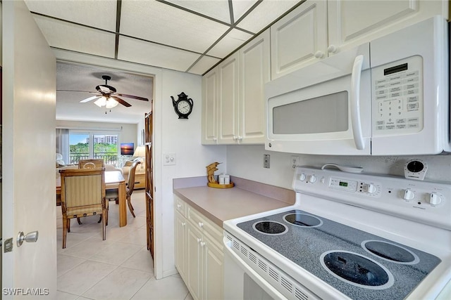 1206 Edington Pl Unit D304, Marco Island, FL 34145 - kitchen with white appliances, light countertops, light tile patterned floors, and a ceiling fan