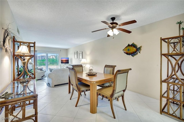 1206 Edington Pl Unit D304, Marco Island, FL 34145 - dining room featuring a textured ceiling, ceiling fan, and light tile patterned floors