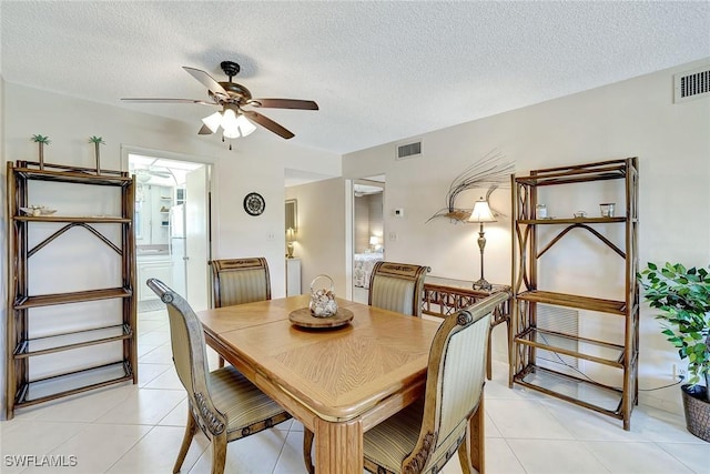 1206 Edington Pl Unit D304, Marco Island, FL 34145 - dining area with ceiling fan, a textured ceiling, and light tile patterned floors