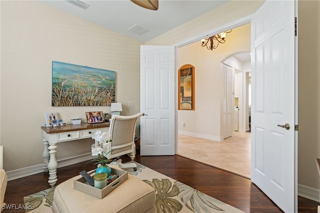 11107 Sparkleberry Dr, Fort Myers, FL 33913 - office area featuring arched walkways, wood finished floors, and baseboards