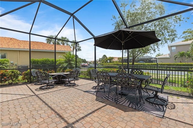 11107 Sparkleberry Dr, Fort Myers, FL 33913 - view of patio featuring outdoor dining space and a lanai