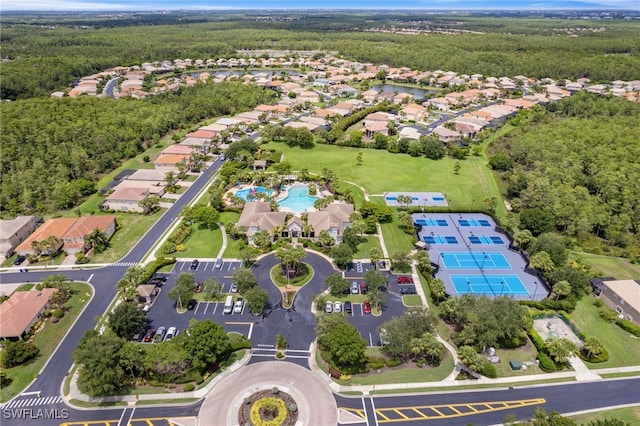 11107 Sparkleberry Dr, Fort Myers, FL 33913 - aerial view of property's location with a forest, a pool, and nearby suburban area