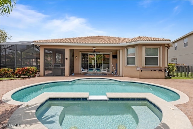 11107 Sparkleberry Dr, Fort Myers, FL 33913 - view of swimming pool with a pool with connected hot tub, a patio, and a ceiling fan