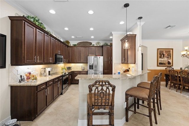 11107 Sparkleberry Dr, Fort Myers, FL 33913 - kitchen with stainless steel appliances, ornamental molding, a peninsula, light stone countertops, and a kitchen bar