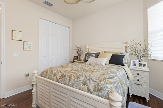 11107 Sparkleberry Dr, Fort Myers, FL 33913 - bedroom with a closet, baseboards, and dark wood-style floors
