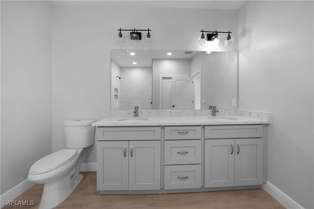4201 17th St SW, Lehigh Acres, FL 33976 - full bath featuring double vanity and wood finished floors