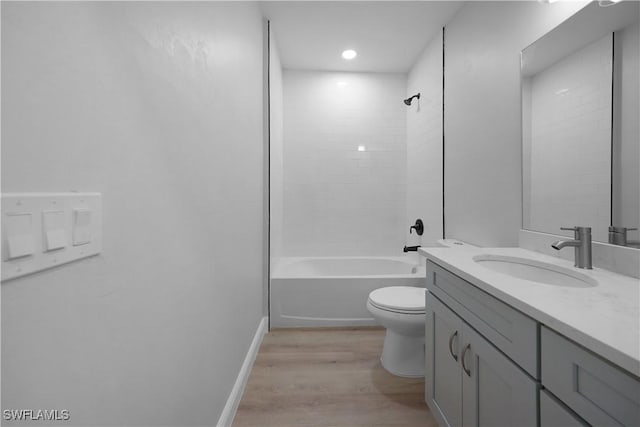 4201 17th St SW, Lehigh Acres, FL 33976 - full bathroom featuring vanity, wood finished floors, and bathtub / shower combination